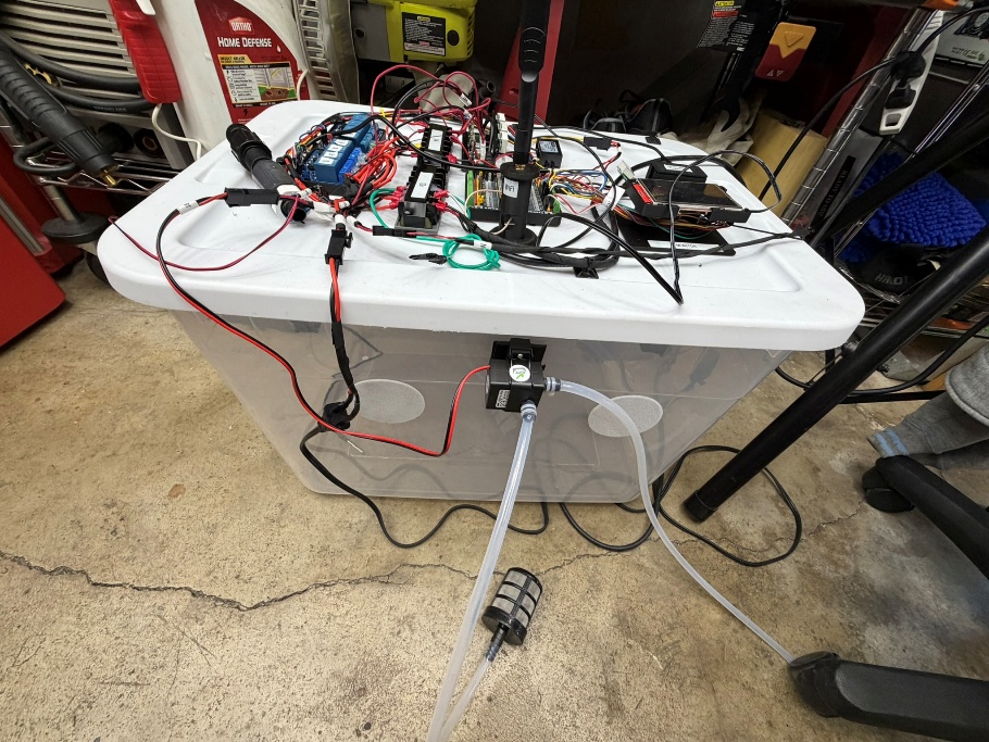 Full automated monotub system with lid-mounted electronics, control wiring, tubing, and pump